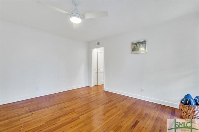 unfurnished room featuring hardwood / wood-style floors and ceiling fan