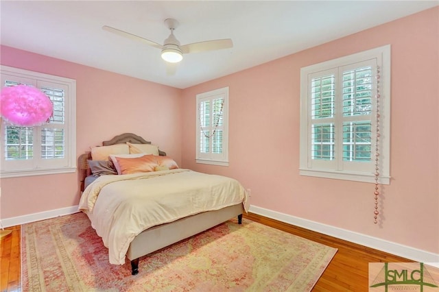 bedroom featuring hardwood / wood-style floors and ceiling fan