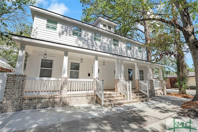 view of front of property featuring covered porch