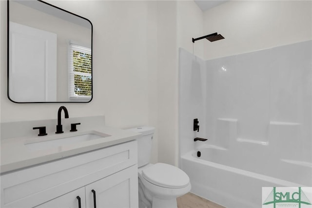 full bathroom featuring vanity, toilet, and bathing tub / shower combination