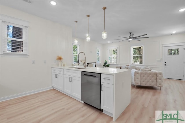 kitchen with white cabinetry, dishwasher, sink, hanging light fixtures, and kitchen peninsula