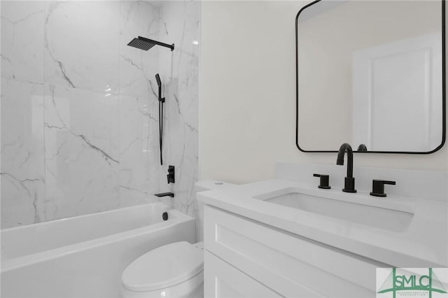 full bathroom featuring vanity, toilet, and tiled shower / bath