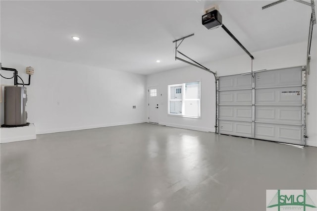 garage featuring a garage door opener and electric water heater