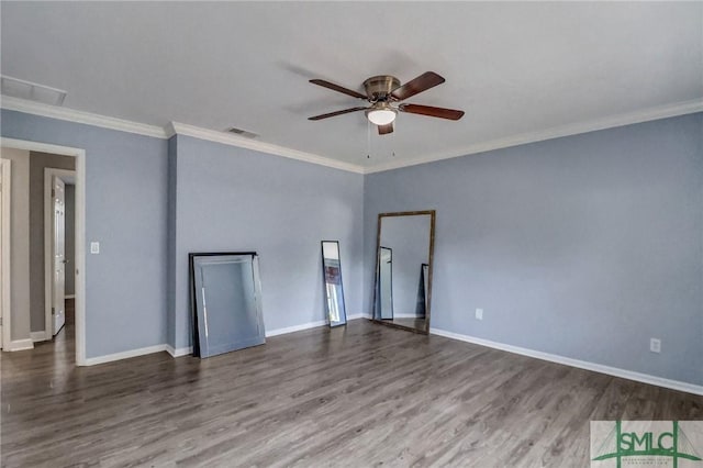 empty room with hardwood / wood-style floors, ornamental molding, and ceiling fan