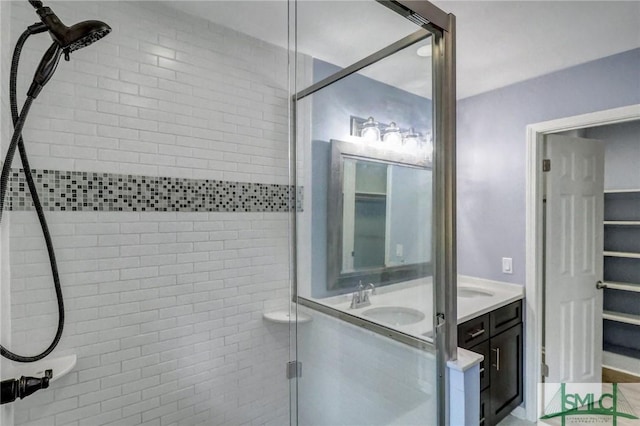 bathroom featuring vanity and walk in shower