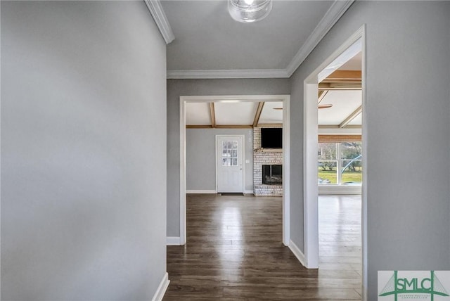 hallway with beamed ceiling, crown molding, and dark hardwood / wood-style floors