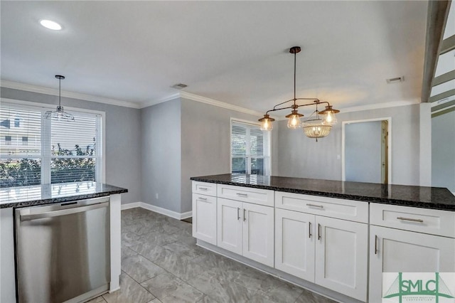 kitchen featuring white cabinetry, hanging light fixtures, dark stone countertops, stainless steel dishwasher, and ornamental molding