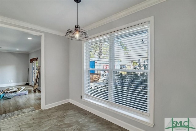 unfurnished dining area with plenty of natural light and ornamental molding