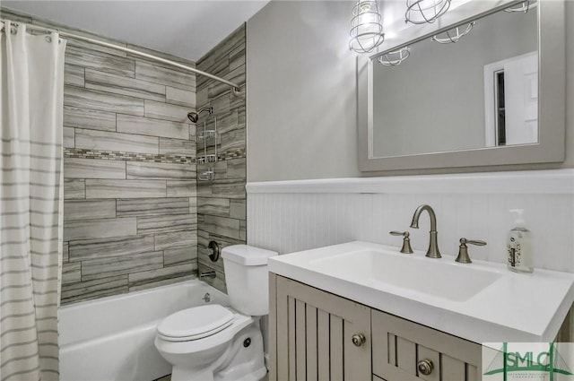 full bathroom with vanity, toilet, and shower / tub combo