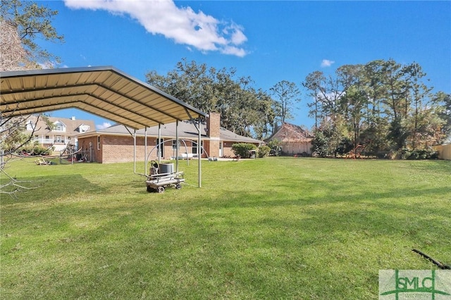 view of yard with a carport