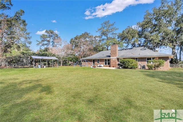 view of yard with a carport