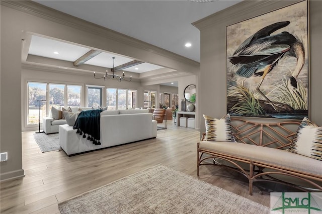 living room with beamed ceiling, a healthy amount of sunlight, light wood-type flooring, and a notable chandelier