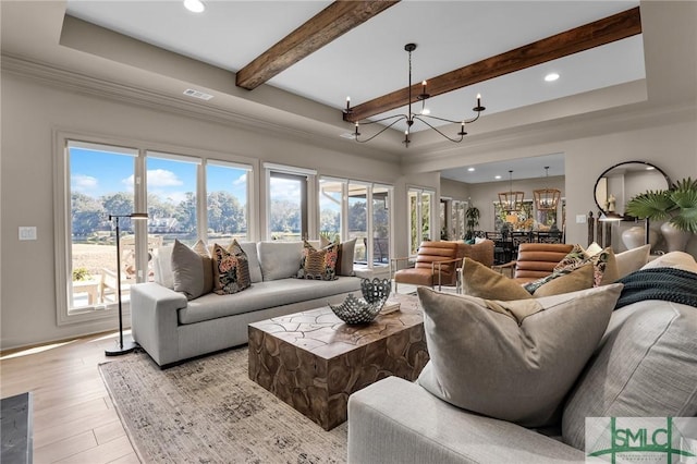 living room with beamed ceiling, a tray ceiling, a notable chandelier, and light hardwood / wood-style flooring