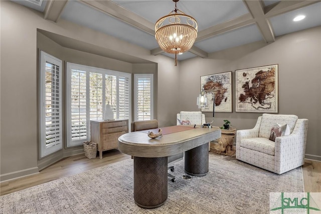 office space featuring beamed ceiling, coffered ceiling, a chandelier, and light hardwood / wood-style flooring