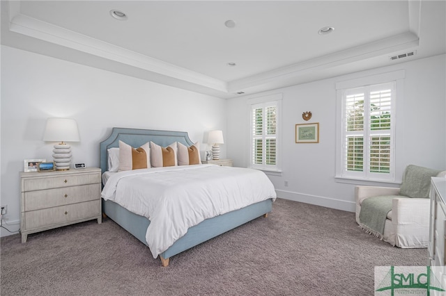 bedroom featuring a raised ceiling, crown molding, carpet, and multiple windows