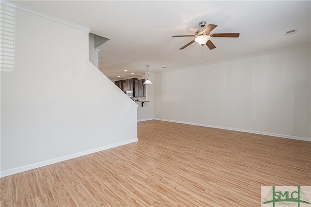 230 Ventura Pl, Pooler, GA 31322 - unfurnished living room with crown molding, ceiling fan, and light hardwood / wood-style flooring