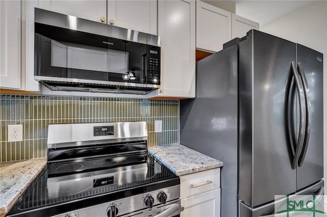 kitchen featuring white cabinetry, backsplash, and stainless steel appliances