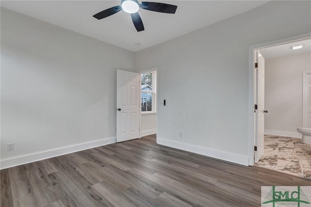 unfurnished room with hardwood / wood-style flooring and ceiling fan