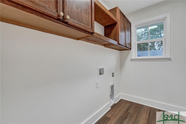 laundry area featuring dark hardwood / wood-style floors, cabinets, hookup for an electric dryer, and hookup for a washing machine