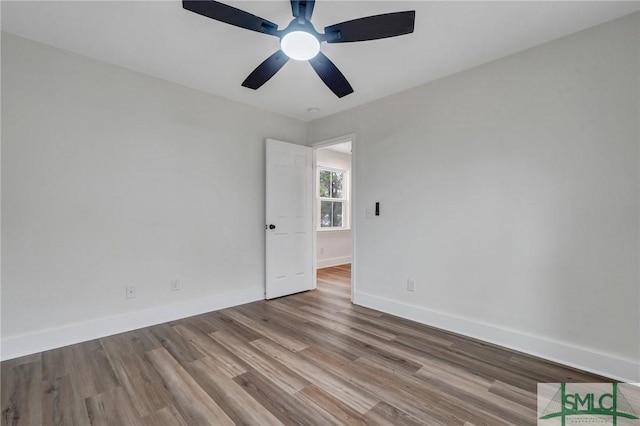 unfurnished room featuring ceiling fan and light hardwood / wood-style floors