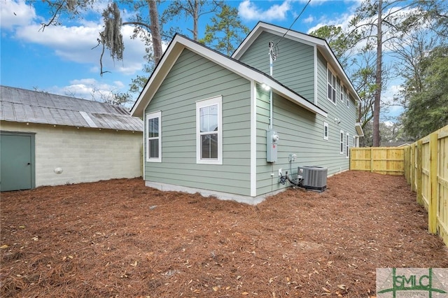 back of property featuring central AC unit