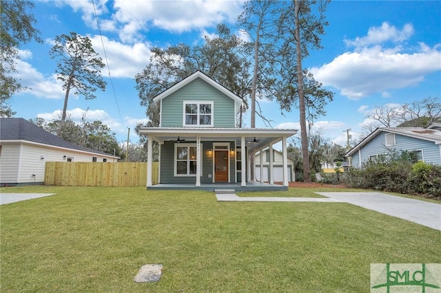 view of front of house with a porch, a garage, and a front yard