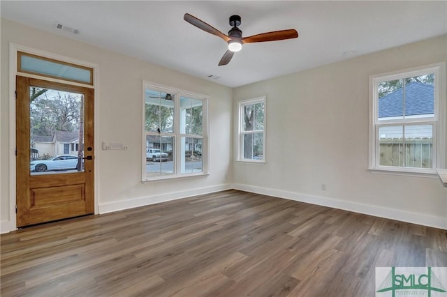 interior space with ceiling fan and hardwood / wood-style floors