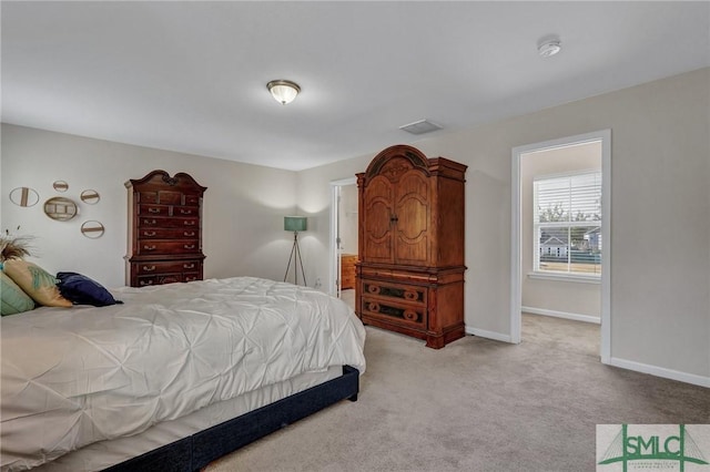 bedroom with light carpet