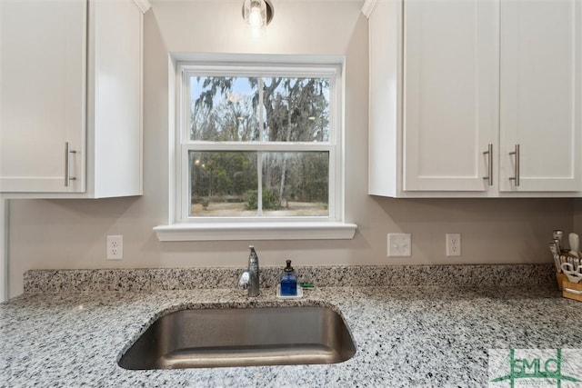 601 Meloney Dr, Hinesville, GA 31313 - kitchen with white cabinetry and light stone counters