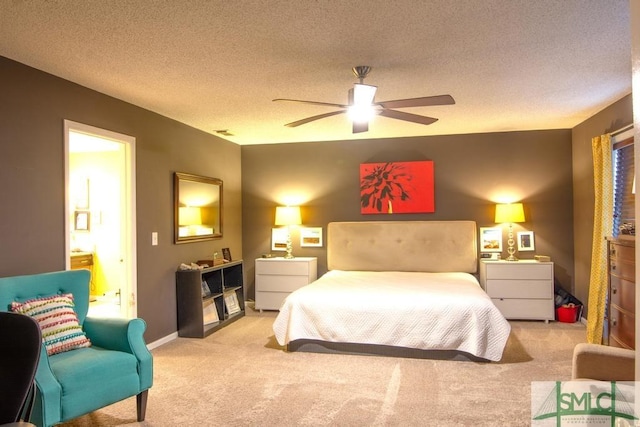 carpeted bedroom featuring ceiling fan and a textured ceiling