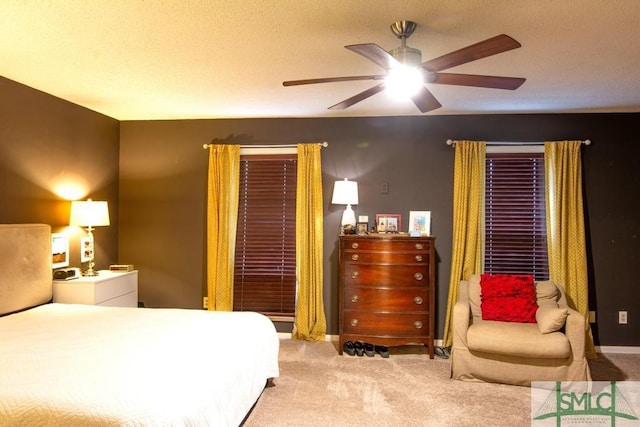 bedroom with ceiling fan and carpet