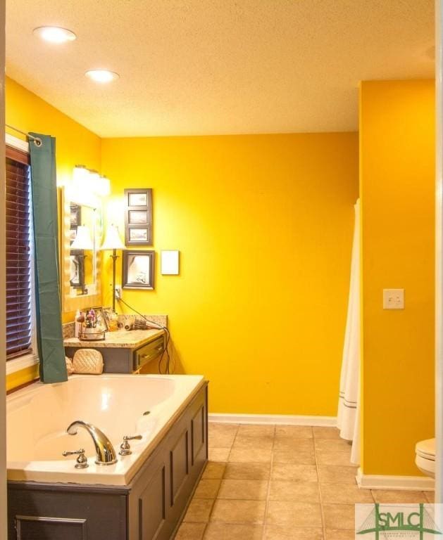 bathroom featuring toilet, a bath, and tile patterned flooring