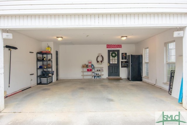 garage featuring black refrigerator