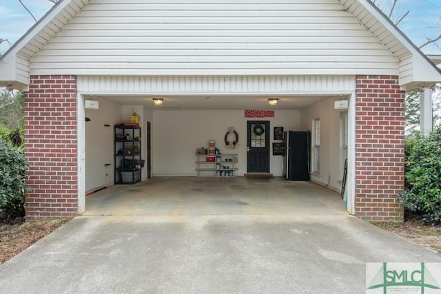 garage with black fridge