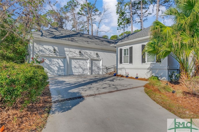 single story home featuring a garage