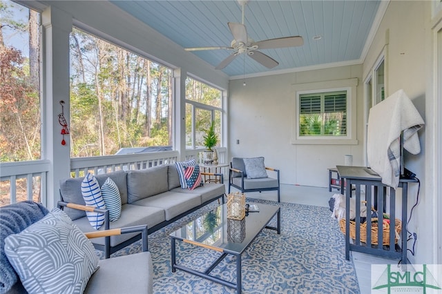 sunroom / solarium featuring wood ceiling and ceiling fan