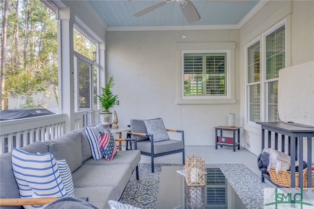 sunroom featuring ceiling fan