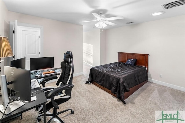 bedroom featuring light colored carpet and ceiling fan