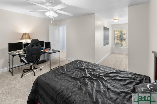 bedroom featuring light carpet and ceiling fan