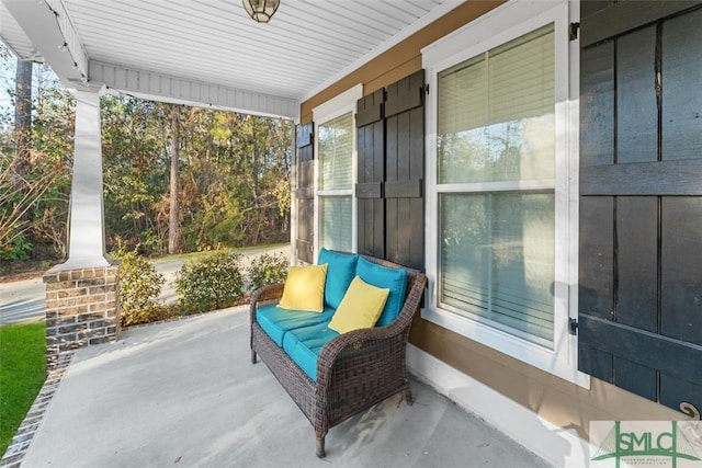 view of patio featuring a porch