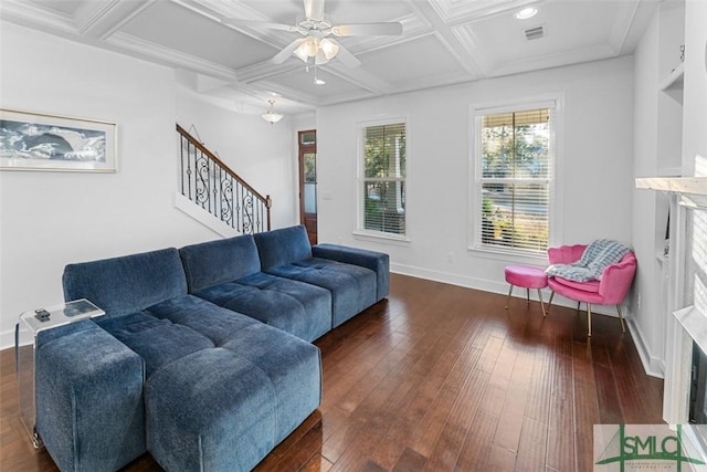 living room with coffered ceiling, ceiling fan, dark hardwood / wood-style floors, and beamed ceiling