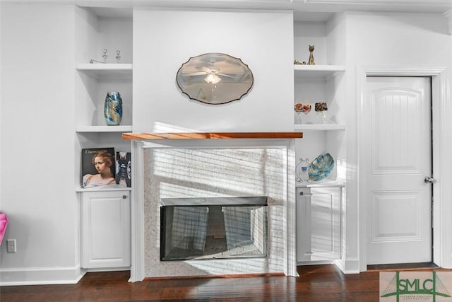 interior details featuring hardwood / wood-style flooring and built in features