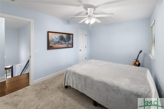 bedroom with light colored carpet and ceiling fan