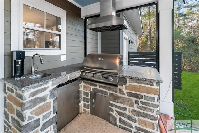 view of patio / terrace with sink, a grill, and an outdoor kitchen