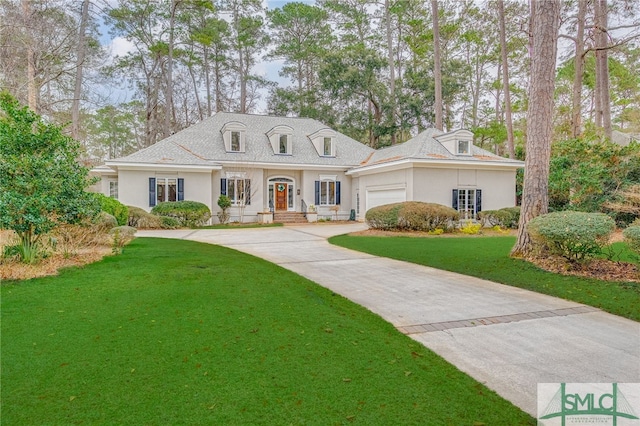 view of front facade featuring a garage and a front yard