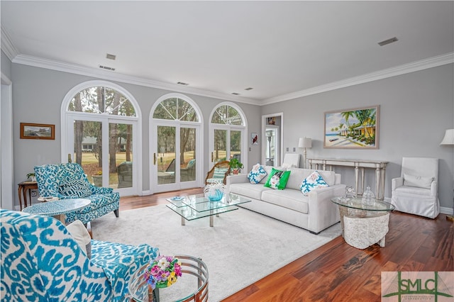 living room featuring ornamental molding and wood-type flooring