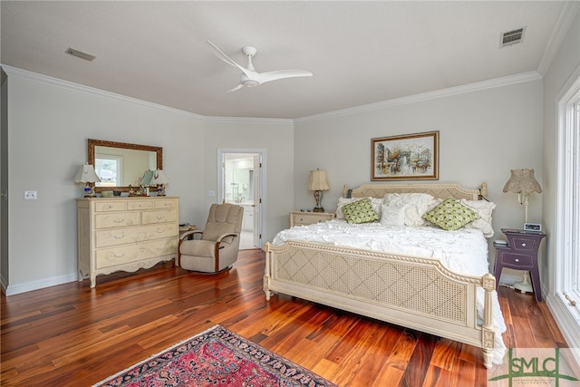 bedroom with dark hardwood / wood-style flooring, crown molding, and ceiling fan