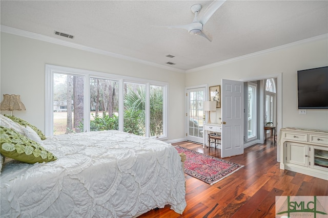 bedroom with ceiling fan, ornamental molding, dark hardwood / wood-style flooring, and a textured ceiling