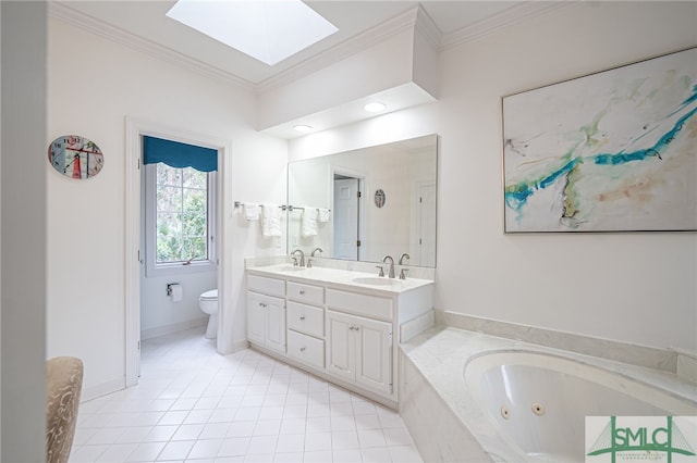 bathroom featuring a skylight, vanity, a relaxing tiled tub, toilet, and crown molding