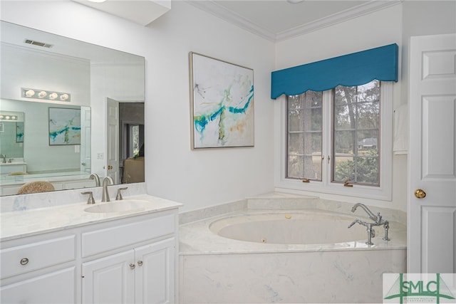 bathroom with crown molding, vanity, and a bathtub